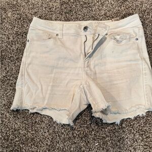 Seven white stretchy shorts. Size 14.